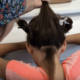 LCA technician checks young girl for head lice
